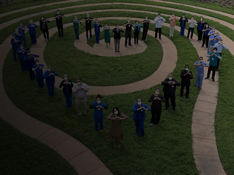 Texas Health Alliance Staff Forming Heart in the Garden